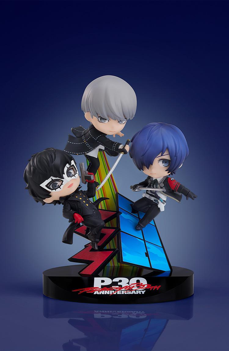 Display view of the Persona 30th Anniversary Nendoroid More vignette figure featuring Joker, Yu Narukami, and Makoto Yuki against a dark blue gradient background.