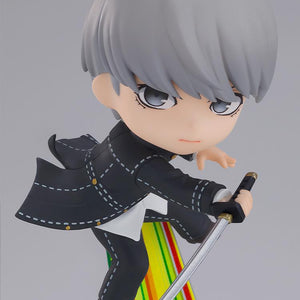 Action close-up shot of the Persona 4 protagonist Yu Narukami Nendoroid figure wielding a katana over a yellow-green striped path background.