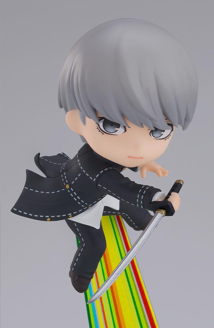 Action close-up shot of the Persona 4 protagonist Yu Narukami Nendoroid figure wielding a katana over a yellow-green striped path background.