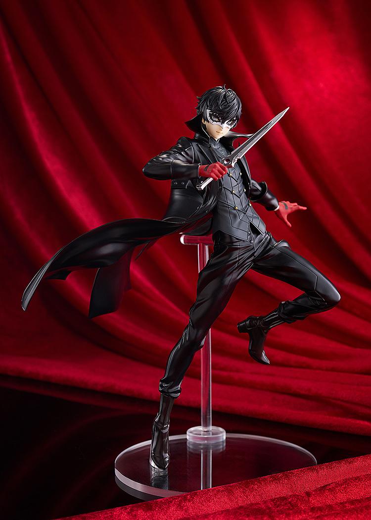 Dynamic full-body shot of the 8.26-inch Joker statue on a clear display stand, featuring his flowing black trench coat.