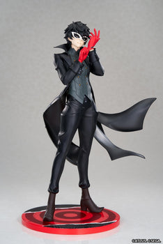 Full-body front view of the Persona 5 Royal Joker 1/8 scale figure by Apex in his black Phantom Thief trench coat adjusting his red gloves against a studio gray background.