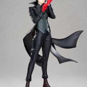 Full-body front view of the Persona 5 Royal Joker 1/8 scale figure by Apex in his black Phantom Thief trench coat adjusting his red gloves against a studio gray background.