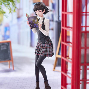 Full-length display shot of the Makoto Niijima 1/7 scale figure positioned next to a red telephone booth on a paved street diorama.