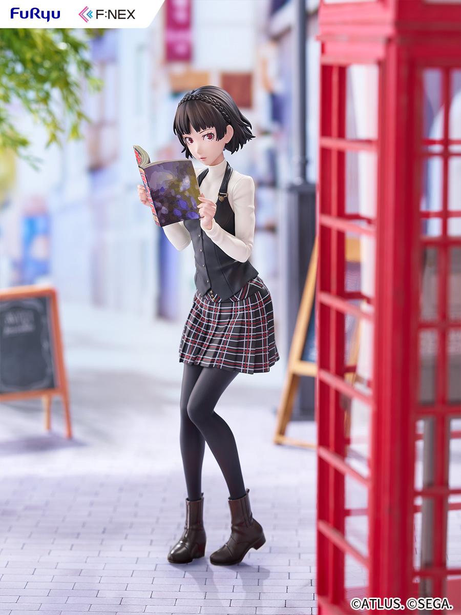 Full-length display shot of the Makoto Niijima 1/7 scale figure positioned next to a red telephone booth on a paved street diorama.