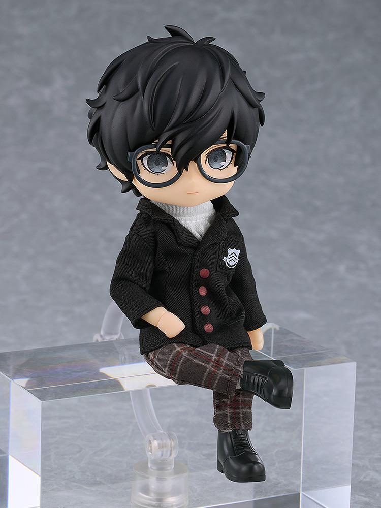 Highly articulated P5R protagonist Nendoroid Doll shown in a relaxed sitting position on a clear block.