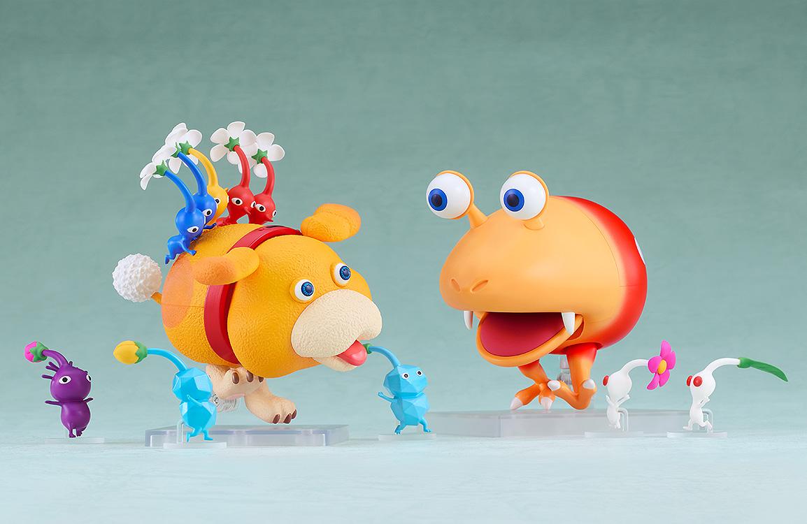 Playful battle scene featuring the Oatchi Nendoroid and Pikmin facing off against a Bulborb figure.
