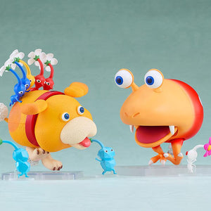 Playful battle scene featuring the Oatchi Nendoroid and Pikmin facing off against a Bulborb figure.