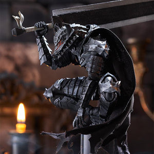 Close-up side perspective diorama shot of Guts in Berserker Armor crouching in a beast-like pose with glowing red eye effects under dramatic lighting.