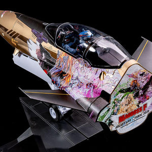 Top-down view of the 1/20 scale YF-29 model kit showing pilot Alto Saotome and elaborate character decals.