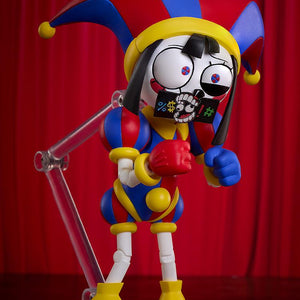 Dynamic comedic pose of the Pomni figma action figure holding the included black swear word censor bleep bar accessory over her mouth.