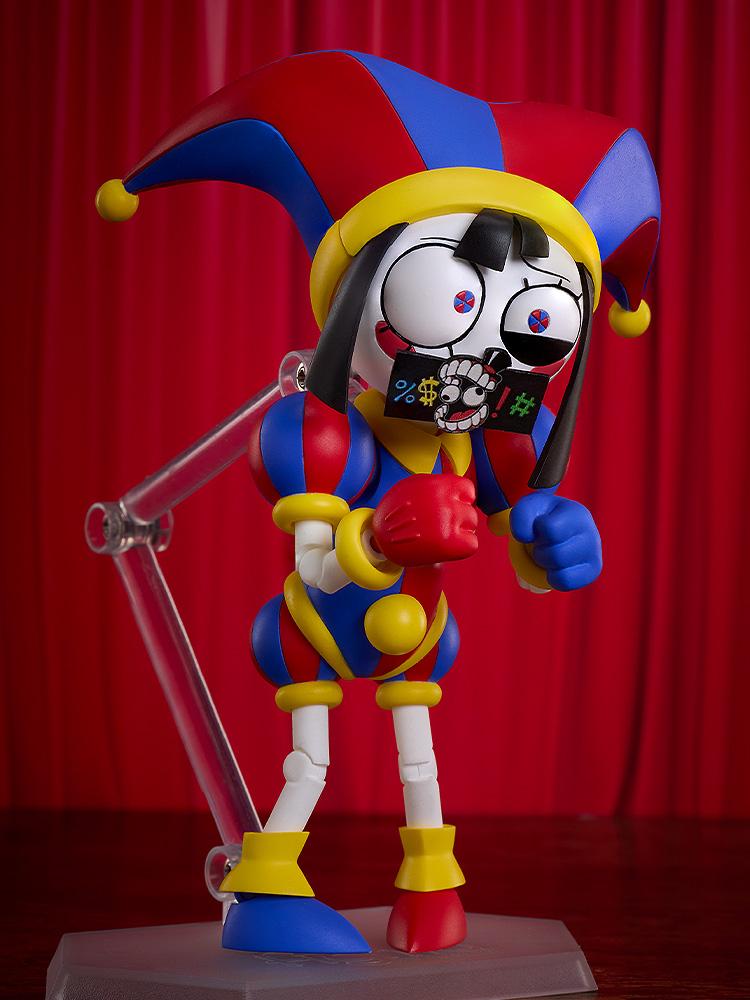 Dynamic comedic pose of the Pomni figma action figure holding the included black swear word censor bleep bar accessory over her mouth.