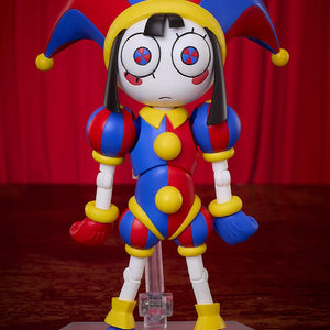 Front view of the fully assembled Pomni figma figure showing her standard neutral face plate with blue and red pinwheel eyes against a red curtain background.