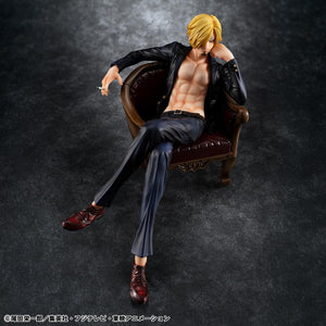 High-angle shot of P.O.P S.O.C. Sanji Ver.R figure lounging in a leather chair with an open black suit jacket and sculpted torso.