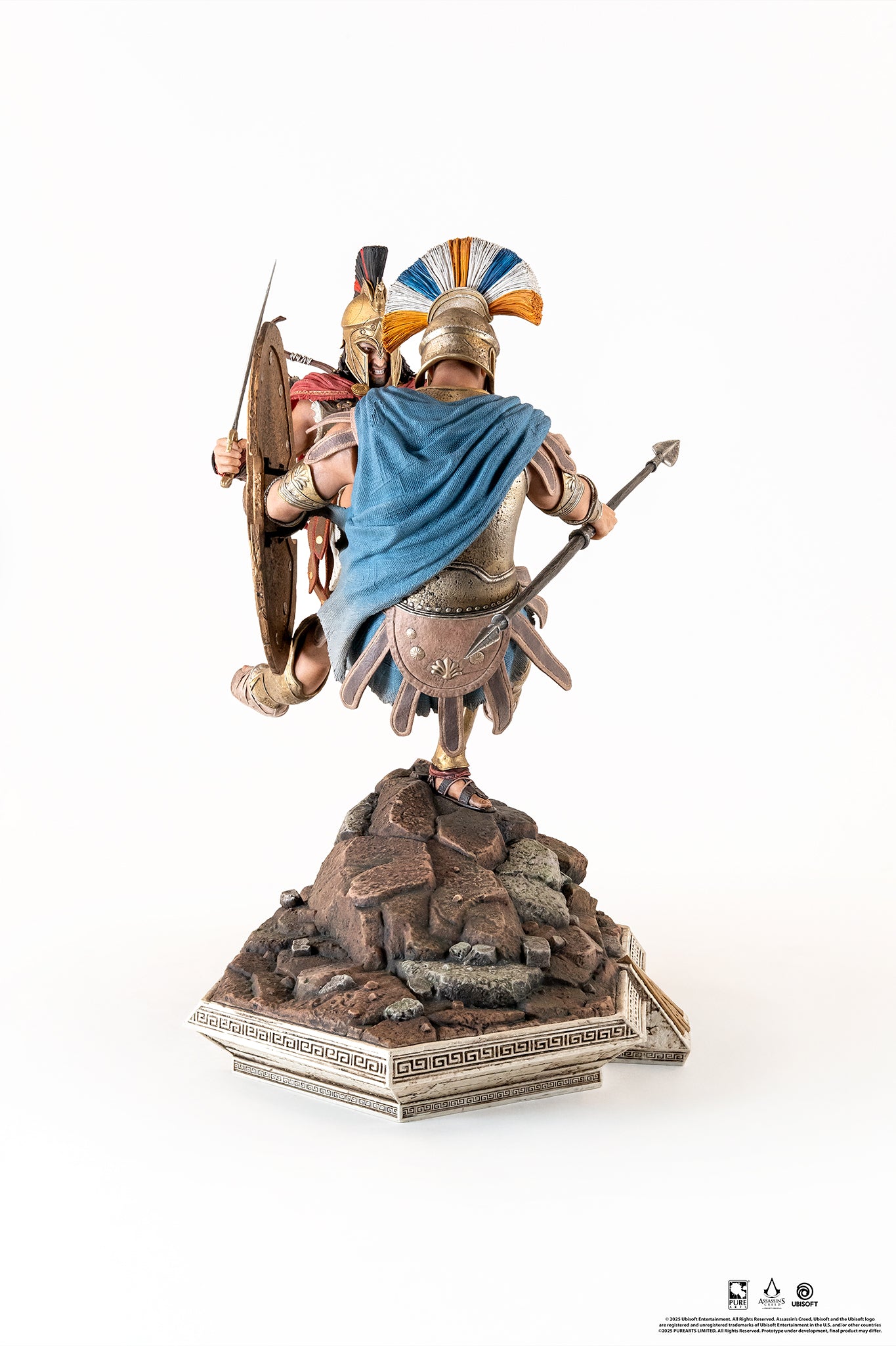 Rear view of the Spartan Kick diorama, showing the back of the Athenian soldier's blue cloak and Alexios' archer quiver.