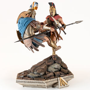 Side profile of the Alexios Spartan Kick statue, showcasing the two figures locked in combat above the rocky base.