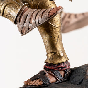 Extreme close-up of Alexios' foot making contact with the Athenian soldier's sandal, showcasing the detailed gold greaves and leather straps.