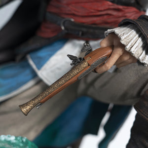 An extreme close-up of Edward Kenway’s hand on the statue, showing the intricate detail of his flintlock pistol and his ruffled shirt sleeve.