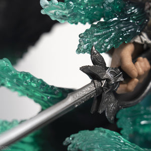 A detailed shot of the hilt of Edward Kenway's saber on the statue, highlighting the intricate silver and black design.