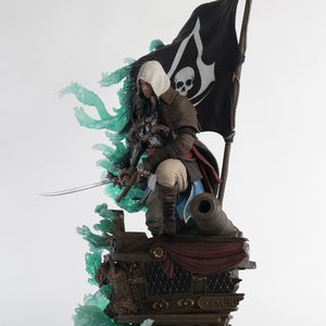 A three-quarter view of the Animus Edward Kenway statue, showing the full pose with his saber drawn and the intricate base.