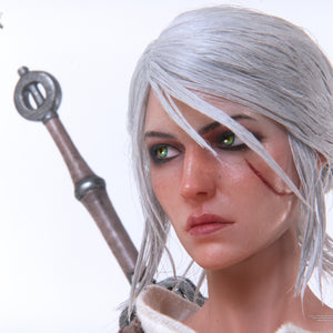 Close-up profile of Ciri's face and gray hair, showing the detailed sculpt and painting of her features.