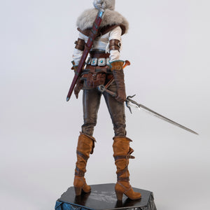 A three-quarter rear view of the Ciri figure, showing the extended metal sword and the detailing of her leather pants.