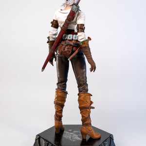 Rear view of the Ciri figure, showing her back, the sword sheath, and the straps of her harness.