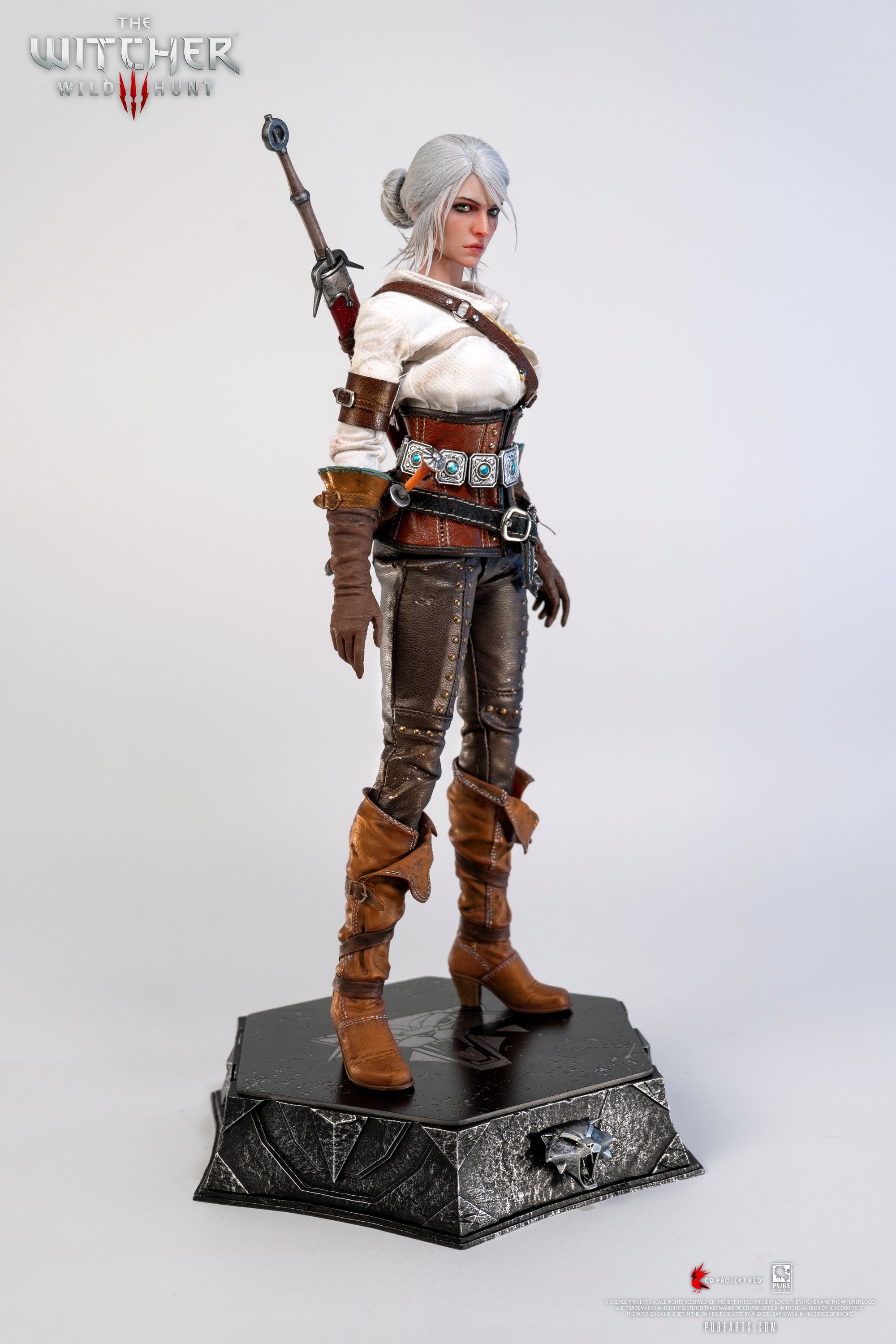A slightly angled frontal view of the Ciri figure, showing her complete costume and hair bun.