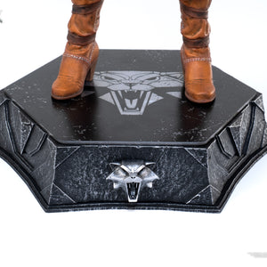 Close-up of Ciri's boots standing on the hexagonal base, highlighting the Witcher Wolf Medallion symbol etched onto the platform.