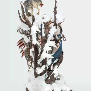A back-angled profile of the Animus Connor statue, showcasing the detailed sculpt of Connor’s back, his quiver of arrows, and the tree branches on the base.