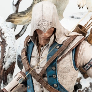 A detailed close-up of Connor's face and hood from the Animus statue, showing the intricate eagle pattern on the hood and the realistic textures of his clothing.