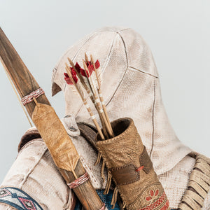 A detailed close-up of the quiver and arrows on the back of the Animus Connor statue, showing the wood texture and feather fletching.