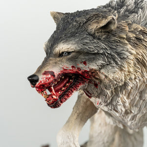 A close-up of the wolf from the Animus Connor statue, highlighting the hyper-realistic sculpt of its face, fur, and teeth covered in blood.
