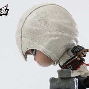 A close-up side profile of the PureArts Qlectors Altaïr figure, highlighting the textured fabric of his hood and his focused expression.