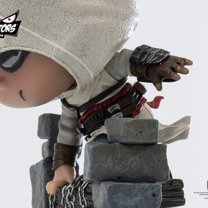 A detailed close-up shot of the PureArts Qlectors Altaïr figure's upper body, showcasing his hand gripping the bell tower chain and the intricate details of his costume.