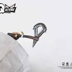 A macro close-up of the hatchet held by the Qlectors Connor figure, focusing on the intricate details of the blade and handle.