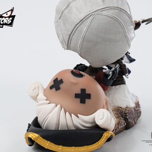 An overhead close-up of the Qlectors Connor figure's head and the defeated British soldier's head, showing the stylized "x" eyes and the soldier's hair.