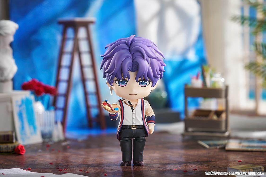 Rafayel Nendoroid figure displayed in an art studio diorama holding a paint palette and brush surrounded by studio props.