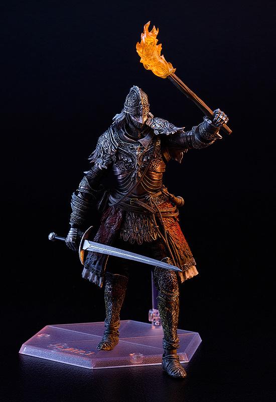 Articulated Elden Ring knight figure holding an illuminated orange translucent torch accessory aloft while gripping a bastard sword in his other hand.