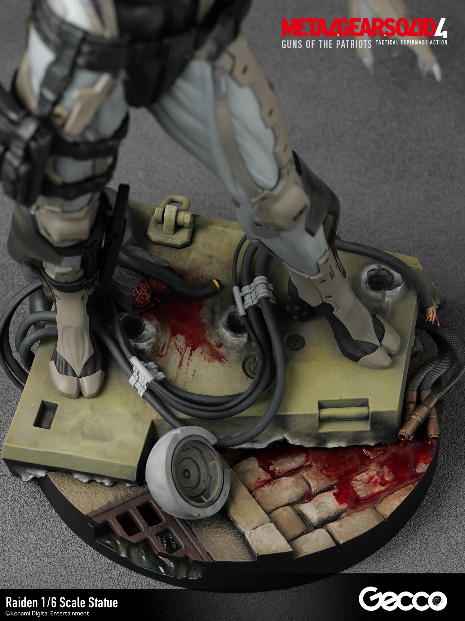 Detailed view of the statue's base showing bullet impacts, severed cables, and weathered stone textures.