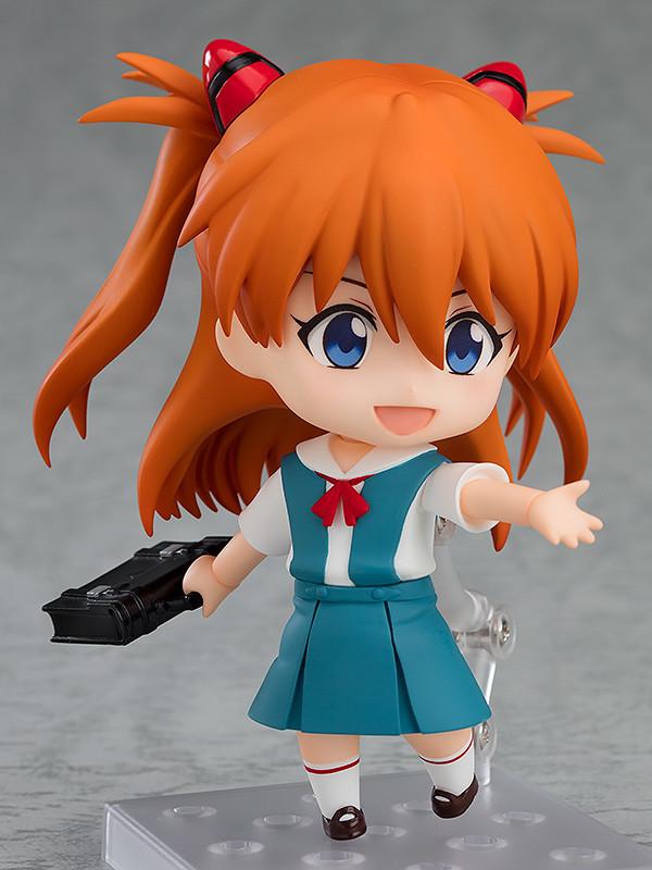 Asuka Shikinami Langley Nendoroid figure holding a black school bag accessory with an open arm gesture
