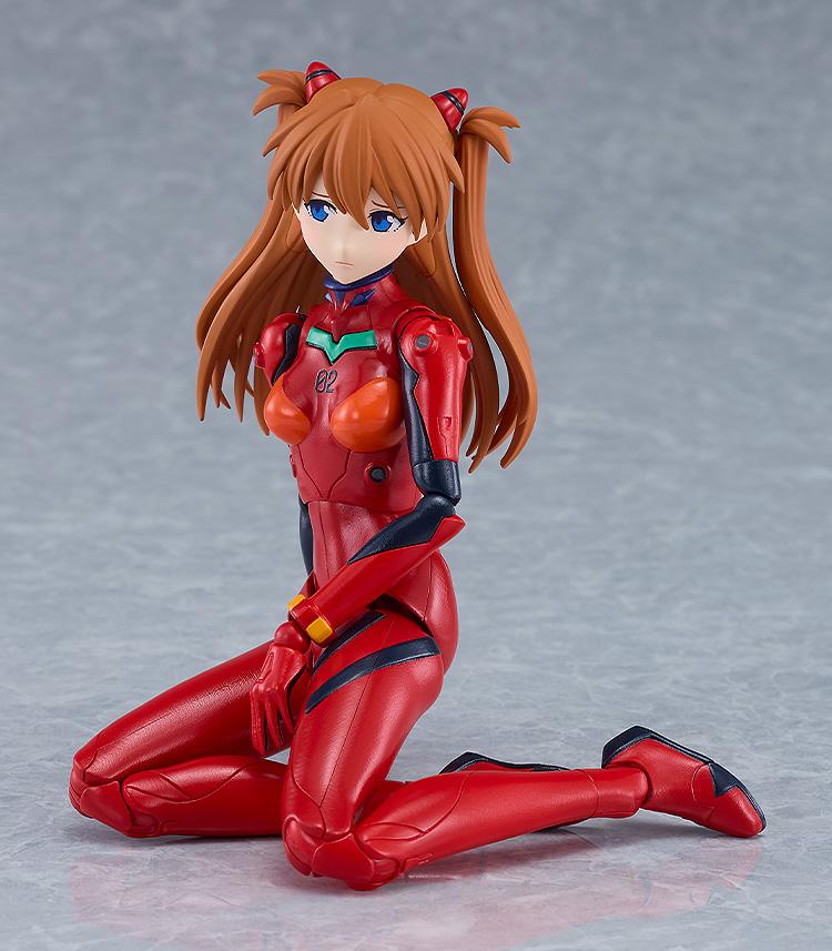 PLAMATEA Asuka Shikinami Langley model kit kneeling on the ground with a somber blushing expression.