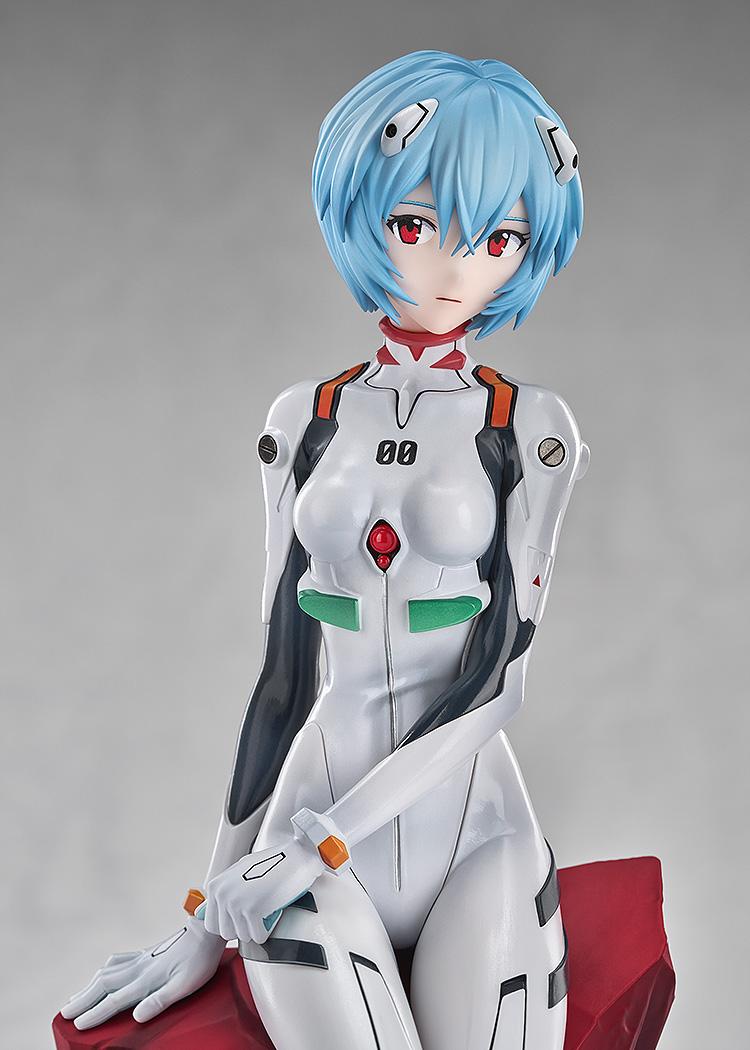 Close-up portrait of the Rei Ayanami figure focusing on her red eyes and the intricate mechanical details of her hair clips.