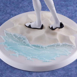 Detailed shot of the figure's base, featuring realistic sand textures and translucent blue water with white sea foam effects.