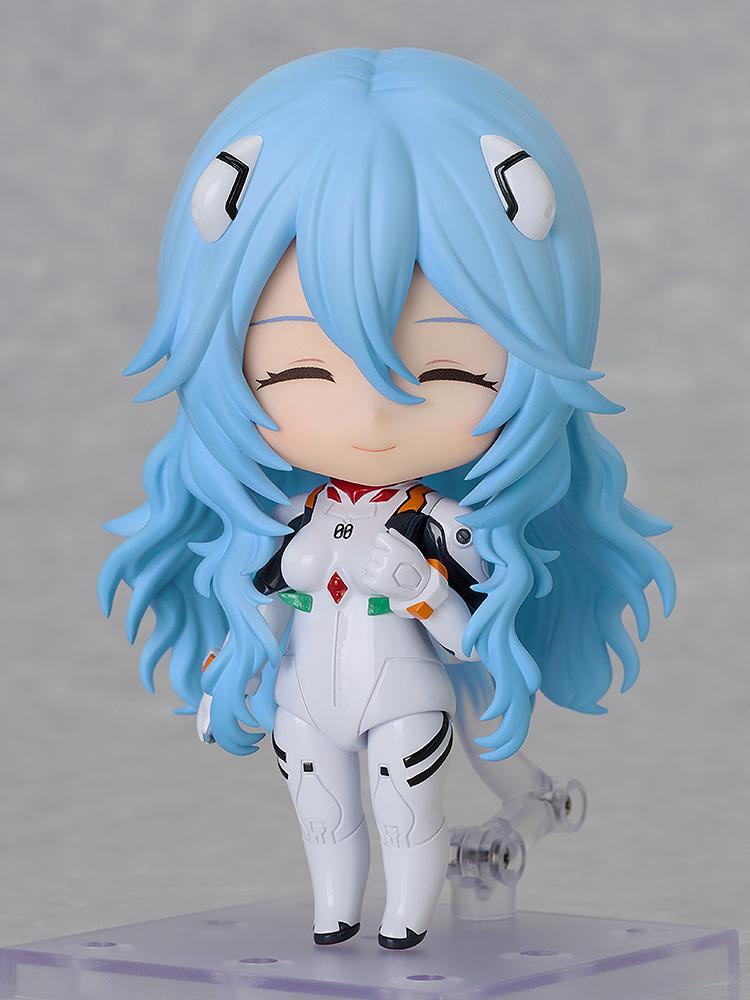 Rei Ayanami Nendoroid with her cheerful face plate showing closed eyes and a happy expression.