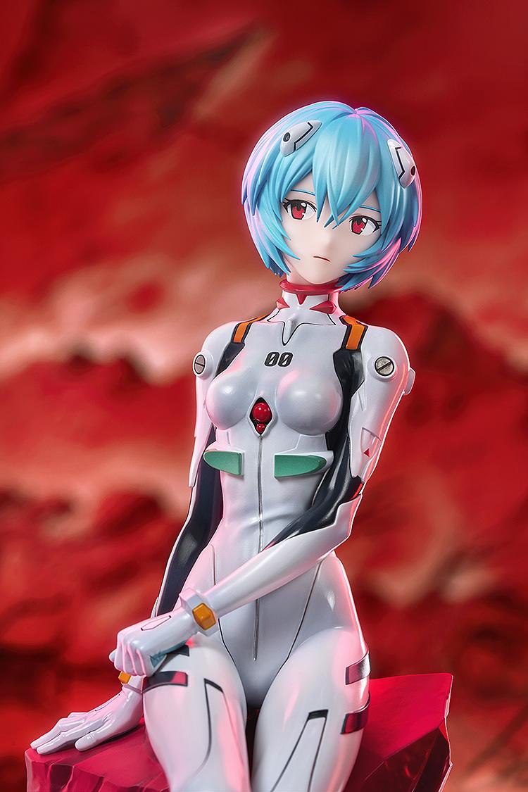 High-quality cinematic close-up of the Rei Ayanami figure's face and upper torso with vibrant red environmental lighting.