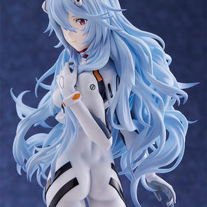 Portrait view of the Rei Ayanami figure from the waist up, showing the wind-blown hair and technical details of the Evangelion plugsuit.