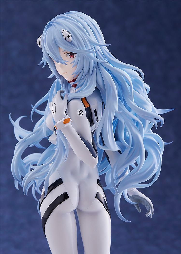 Portrait view of the Rei Ayanami figure from the waist up, showing the wind-blown hair and technical details of the Evangelion plugsuit.