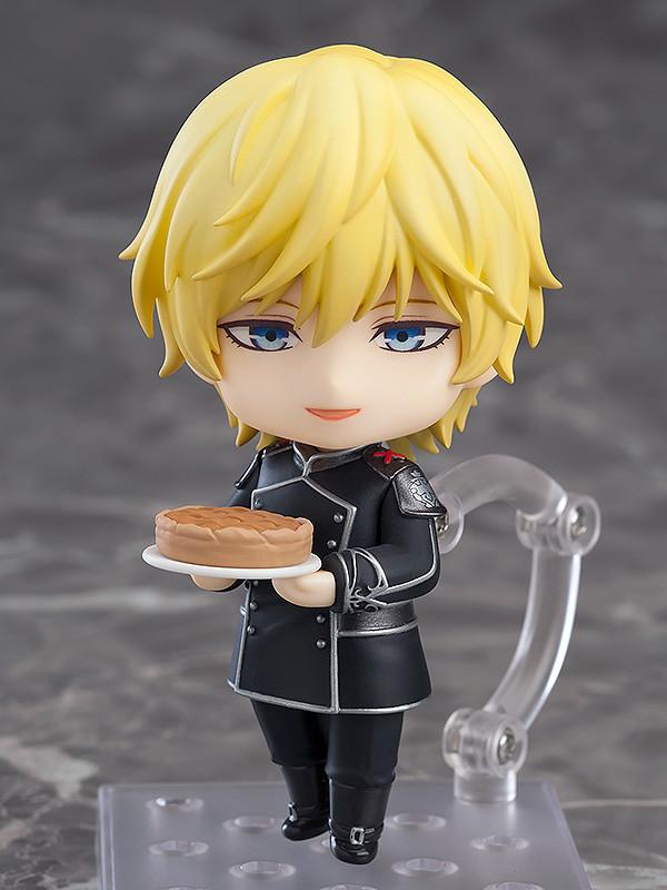 Reinhard von Lohengramm Nendoroid with a smiling face plate holding a Kelsey cake baked by his sister Annerose.