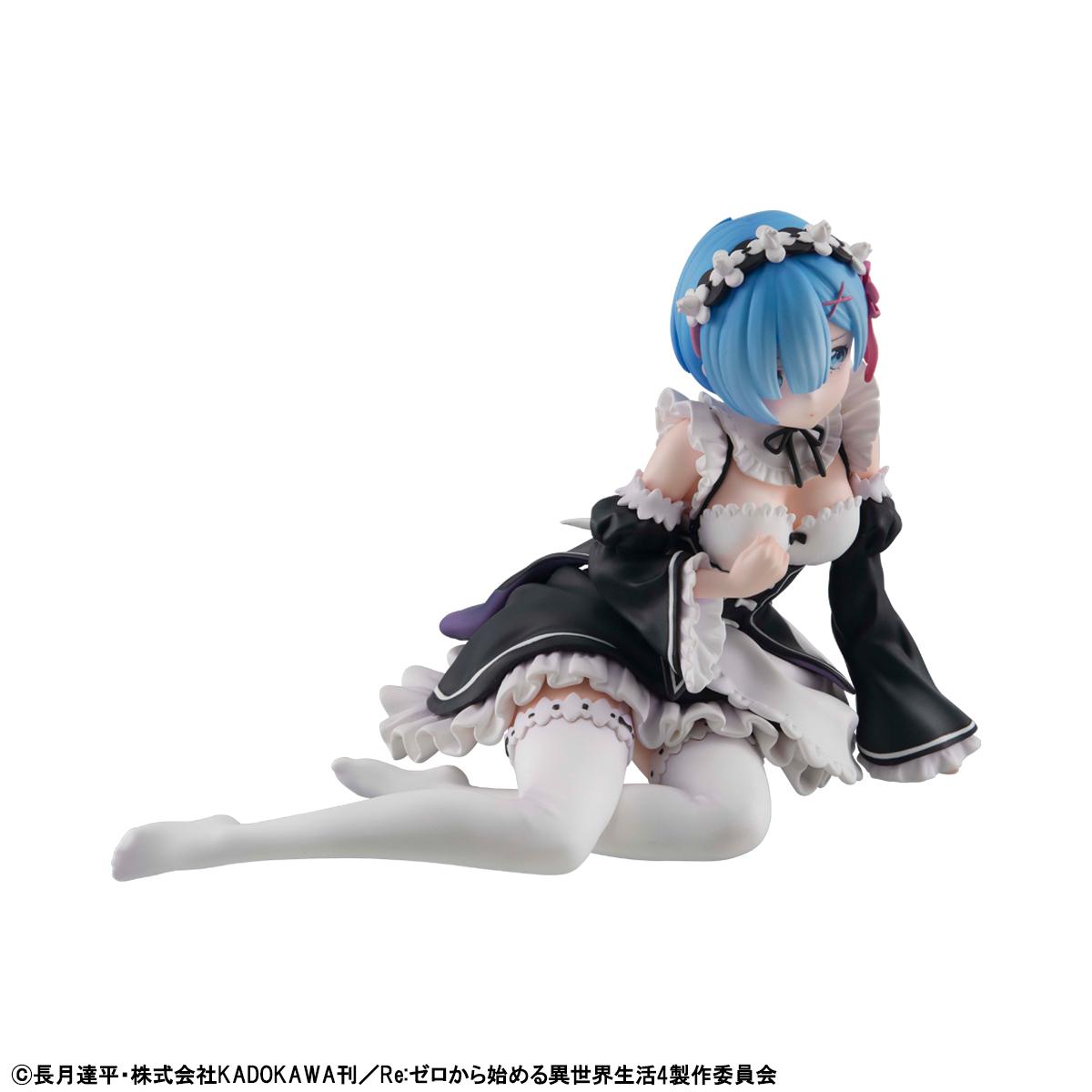 Three-quarter view of the Rem Melty Princess figure lying down with blue hair and detailed white ruffle accents.