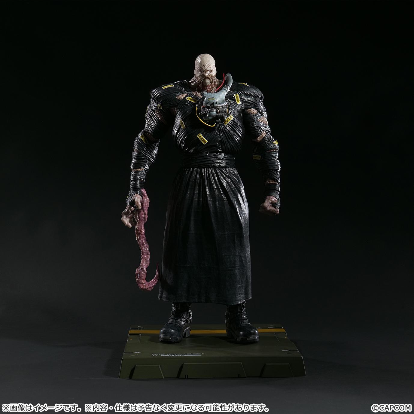 Detail view of the Nemesis figure featuring the interchangeable tentacle arm part extended downward.